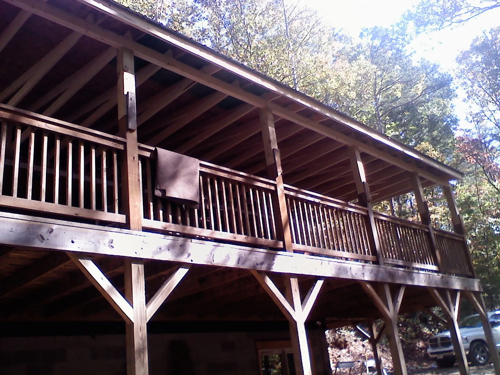 Timber framing under a new elevated porch and deck — Roof Leak Repair in Westborough by Roofing Brothers